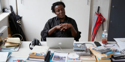 John Akomfrah at his London studio, 2016, © Smoking Dogs Films; Courtesy Smoking Dogs Films and Lisson Gallery