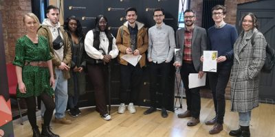 Coventry University graduates were among the winners at the Royal Television Society Midlands Student Awards. Adrian (centre wearing brown jacket) pictured with his award.