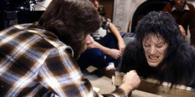 Behind the scenes on the film An American Werewolf in London with special effects make-up artist Rick Baker applying the finishing touches to the werewolf transformation make-up.