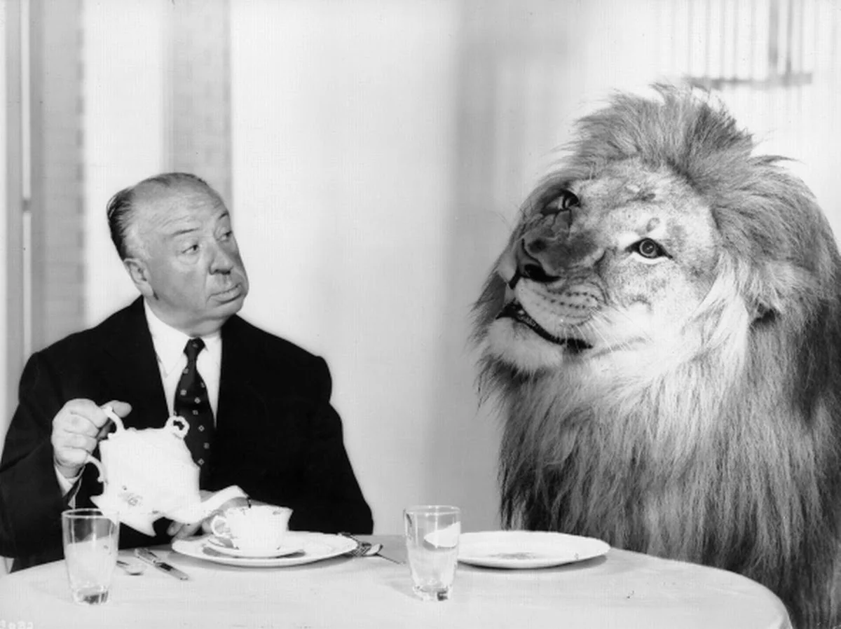 Alfred Hitchcock and the MGM lion.