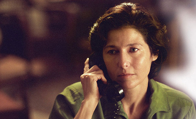Catherine Keener on an old corded telephone in Capote.