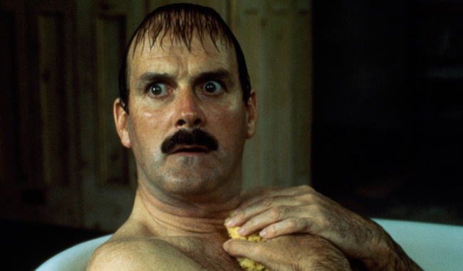 John Cleese naked in a bath in comedy film Clockwise (1986)