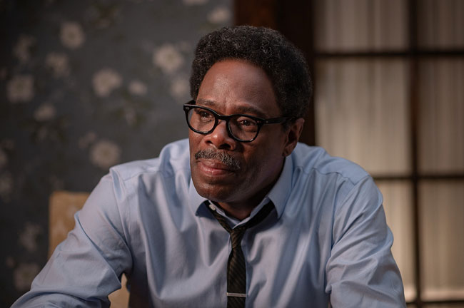 Colmon Domino wearing glasses with thick, rounded rims in the film Rustin.