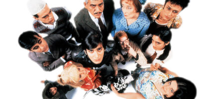 A cast photo featuring Jimi Mistry, Om Puri and Linda Bassett among others who appeared in East is East. the 1999 British film.