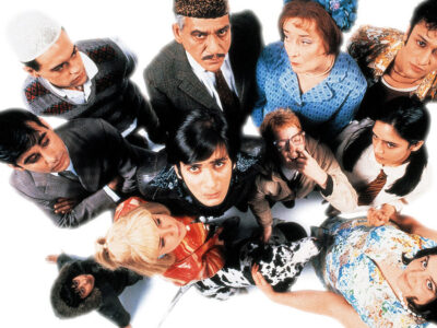A cast photo featuring Jimi Mistry, Om Puri and Linda Bassett among others who appeared in East is East. the 1999 British film.