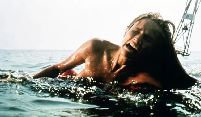 Chrissie Watkins screaming in pain as she is attacked while swimming in the ocean in the film, Jaws (1975)