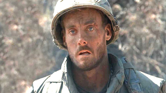 Actor John C. McGinley, pictured in the 1980s wearing Vietnam War-era U.S. military fatigues as the sycophantic Sgt. Red O'Neill in the film Platoon.