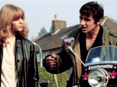 Phil Daniels and Leslie Ash with a motorbike in the film Quadrophenia.