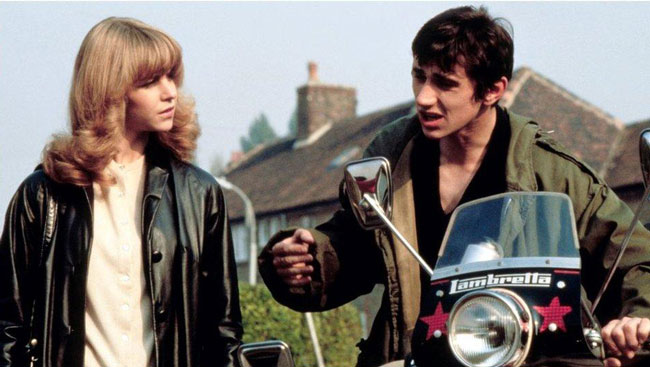 Phil Daniels and Leslie Ash with a motorbike in the film Quadrophenia.