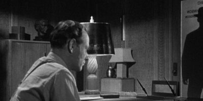 The Soul of a Monster stars Rose Hobart, George Macready, Jim Bannon, Jeanne Bates and Erik Rolf, and in this image we see a shadowed male standing in a doorway.