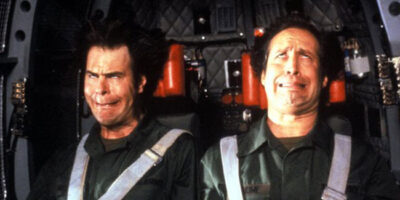 Dan Aykroyd and Chevy Chase experience strong G-forces, causing their faces to contort in an amusing way, in the film Spies Like Us.