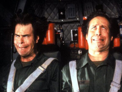 Dan Aykroyd and Chevy Chase experience strong G-forces, causing their faces to contort in an amusing way, in the film Spies Like Us.