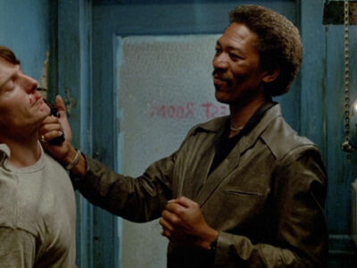 Morgan Freeman holds a gun to Christopher Reeve's face in the film Street Smart.