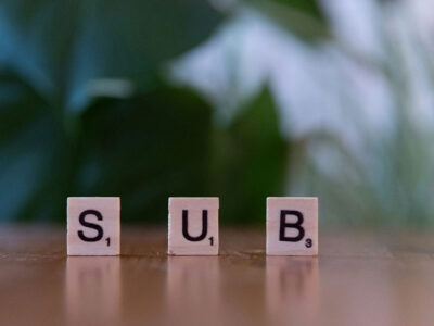 Subscription generic image depicting Scrabble letter counters that spell out the word "sub".