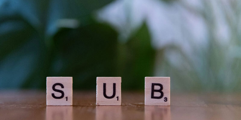 Subscription generic image depicting Scrabble letter counters that spell out the word "sub".