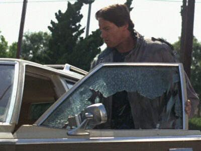 Arnold Schwarzenegger as the Terminator smashes a car window on Sunset Boulevard - it was shot without permits or a stunt double.