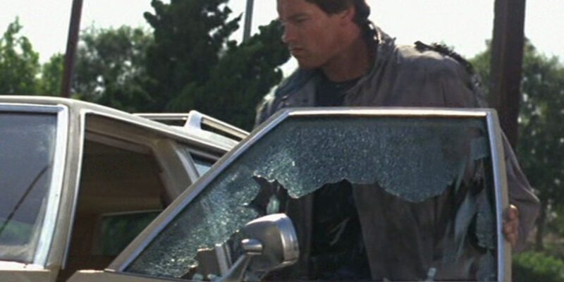Arnold Schwarzenegger as the Terminator smashes a car window on Sunset Boulevard - it was shot without permits or a stunt double.