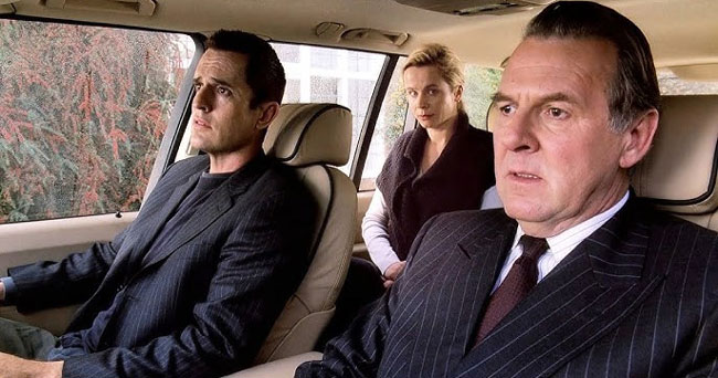 Tom Wilkinson is seen in the front passenger seat of a large car in the film Separate Lies.