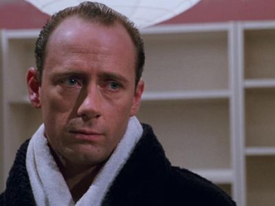 Xander Berkeley looking glum with a towel around his neck in the horror film, Candyman.